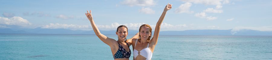 girls smiling on a ferry ride from cairns to the islands