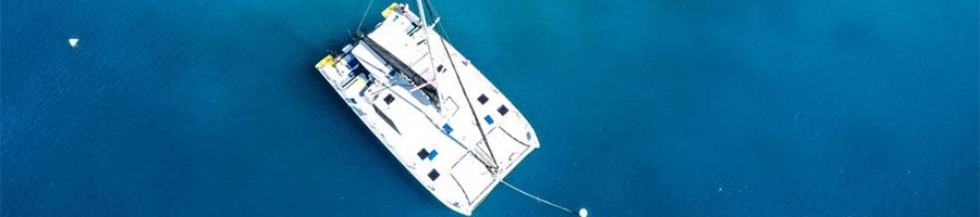 aerial view of white catamaran in the whitsundays