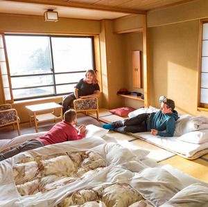 Backpackers in their beds at Shibu Hotel in Nagano