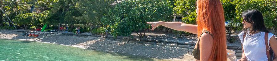 girl pointing at the beach on the fitzroy island pier