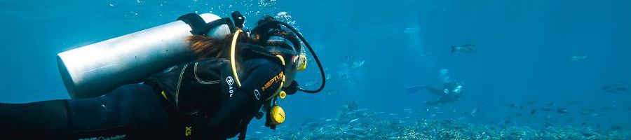 girl scuba diving underwater on the great barrier reef