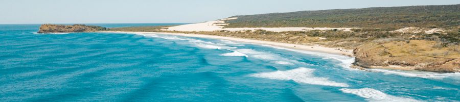 coastline of kgari with blue oceana nd rolling hills