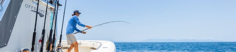 A man fishing on a boat in the Whitsundays