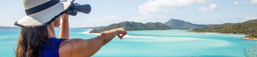 girl admiring the view of hill inlet with binoculars