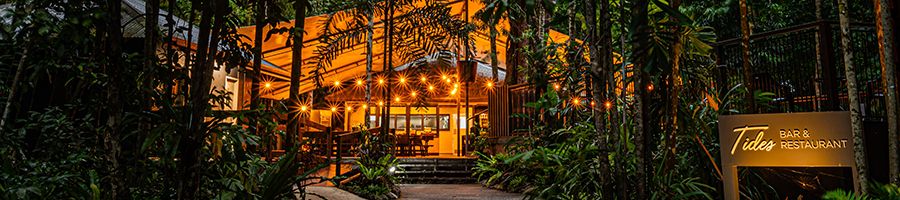 Tides Bar and Restaurant at night in the rainforest with lights
